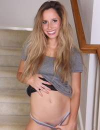 Solo girl Piper Candlewick kicks off her panties for nude poses on stairs