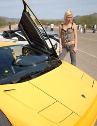 Cute golden-haired Christine flashing her petite tits and ass crack at a car show