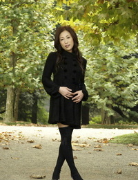 Wholly covered Japanese youthful girls in the park in brown garments and