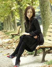 Fully clothed Japanese teen pretties in the park in black clothes and stockings