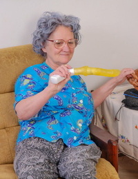 Big boobed teen fucks a curly haired granny with a yellow sex toy