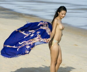 Asian unpaid wanders along a seashore apropos unparalleled their way bikini bottoms
