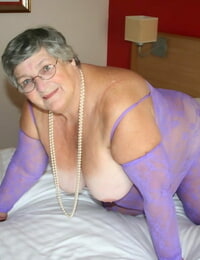 British fatty Grandma Libby masturbates on a couch in a crotchless bodystocking