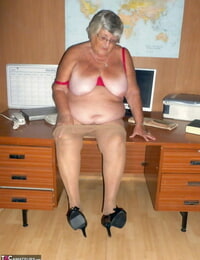 Obese British nan Grandma Libby gets completely bare on a computer desk