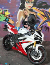 Fat light-haired Samantha gets nude in over the knee boots on a motorcycle