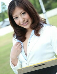 Japanese lady Jun Sena exposes her bosom while clad for office work