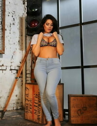 Gorgeous black-haired Charley S in taut denim unveiling her gorgeous big knockers