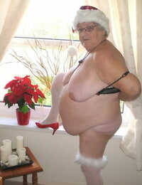 British nan Grandma Libby exposes her big body in a Christmas hat and hosiery