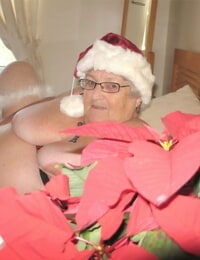 British nan Grandma Libby exposes her big body in a Christmas hat and hosiery