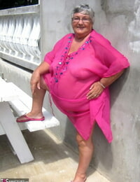 Old chick Grandma Libby reveals her morbidly obese body on a picnic table