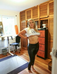 Mature blonde Eva Moore takes off her latex pants- shows tits and masturbates