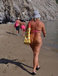 Hugely chesty mature whore Chrissy swims and lounges at the beach stark bare