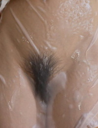 Japanese teen Maiko Kazano wets her great tits and bush while taking a bath