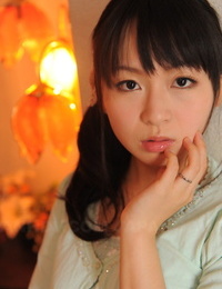 Fully clad Japanese girl Nozomi Hazuki holds her face rock hard in printed mini-skirt