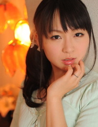 Fully clad Japanese girl Nozomi Hazuki holds her face rock hard in printed mini-skirt