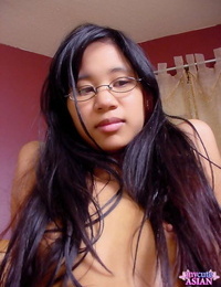 Asian first timer oils up her shaved pussy with her glasses on