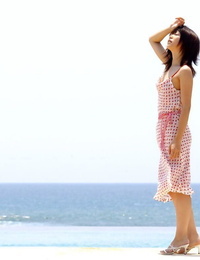 Youthfull looking Japanese woman Saki Ninomiya gets naked with ocean behind her