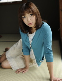 Japanese solo chick Juri Kitahara tentatively shows her hairless pussy