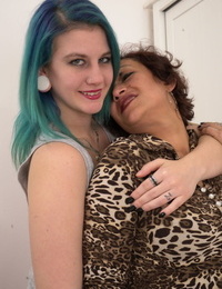 Old and young lesbians undress before a pussy licking session on a bed