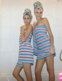 Cute fledgling stunners Laura & Katrina pose in the bathroom after taking a shower