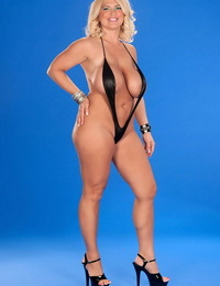 Ash-blonde bbw Kelly Christiansen lubricates up her tits in a v string bikini