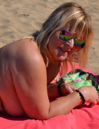 Whorish mature naturist with large boobs Chrissy shows her scorching forms at the beach