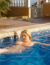 Angry looking naked fatty Ashley Sage Ellison flaunts her thick tits in the pool