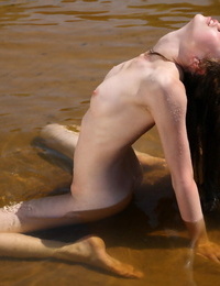 Slightly 18 teen Nicole gets glazed in seaweed while nude in the water