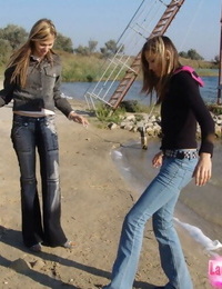 Youthfull lesbians Katrina & Laura smooch outdoors before eating bare torsos