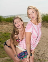 Young ladies Alisha & Dominika shed bikinis during lesbian play at the beach