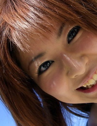 Adorable Japanese girl Miyu Sugiura frees sand clad ass while getting naked