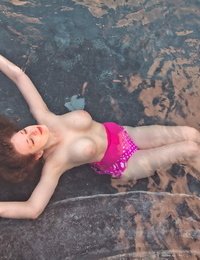 Redhead doll Misha Lowe extracts her hooters from her bikini