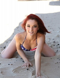 Pallid redhead Kylie Cole doffs cutoffs to model USA themed bathing suit at the beach