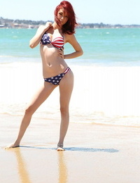 Pallid redhead Kylie Cole doffs cutoffs to model USA themed bathing suit at the beach