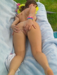 Sweet teen removes her bikini before finger spreading her tight slit
