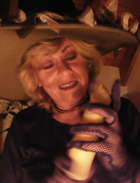 Wild mature witch Caro sticking a big faux-cock up her tasty labia for a Halloween