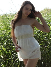 Beautiful teen Valery Leche steps out of her sundress to model allegiance naked