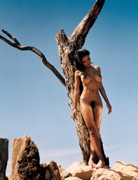 Stunning Playboy models pose erotically flaunting perfect big tits outdoors