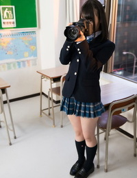 Japanese schoolgirl puts down her camera long enough to suck off her teacher