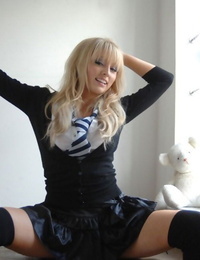 Hot blonde schoolgirl Elle Parker sheds uniform posing braless in lace subjugation
