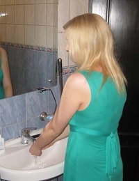 Young light-haired and her boyfriend begin their lovemaking in the bathroom