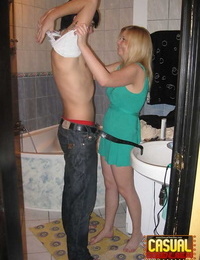 Young blonde and her boyfriend commence their lovemaking in the bathroom