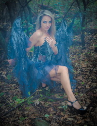 Fairy cosplay chick Nikki Sims doffs her wings and wisp to posture in a panty