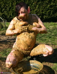 Thick amateur Mary Bitch drinks her own pee while playing in mud like a sow