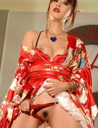 Cute Japanese Marica Hase taunts in kimono before fingering her delicious images