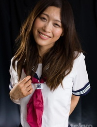Cute Japanese woman bears a gonzo face nail in her sailor uniform