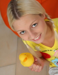 Young blonde chick Pinky June joys her pussy with a rubber duck