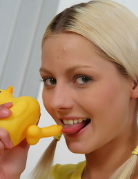 Young blonde chick Pinky June joys her pussy with a rubber duck