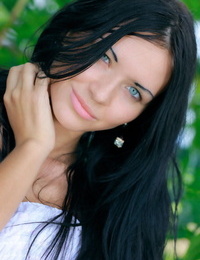 Constant Russian teen Kitti A undresses fully bare under a tree