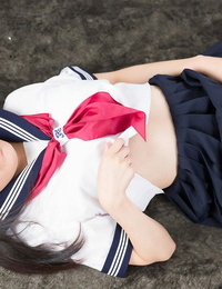 Tongues Japanese schoolgirl bares her pussy before getting jizz on face after a Hand job